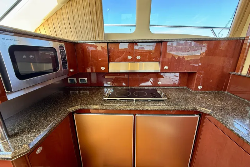 Slide: The Image of Luxurious kitchen in 2007 Sea Ray 52 Sedan Bridge yacht with modern appliances. - 66