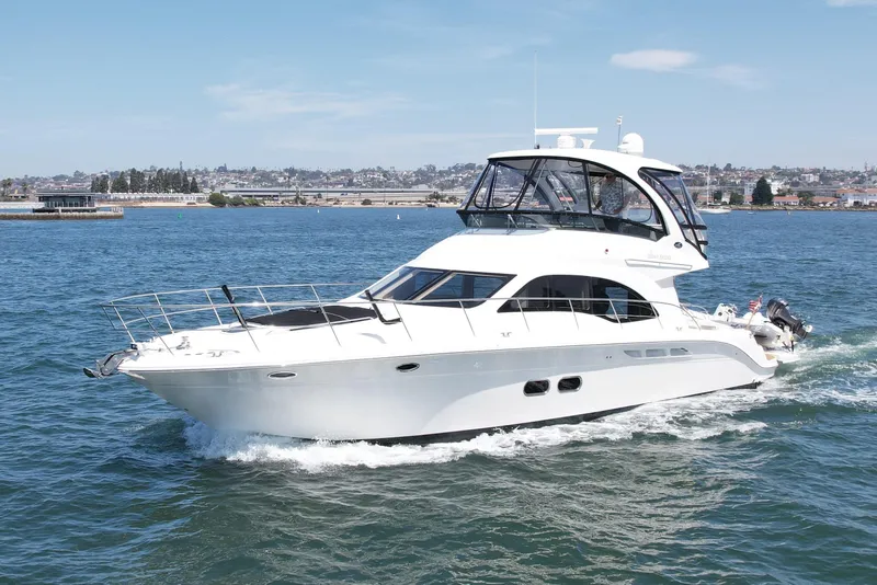 Slide: The Image of 2007 Sea Ray 52 Sedan Bridge yacht cruising on open water. - 7