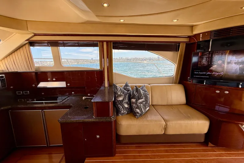 Slide: The Image of Luxurious interior of 2007 Sea Ray 52 Sedan Bridge yacht with scenic ocean view. - 70