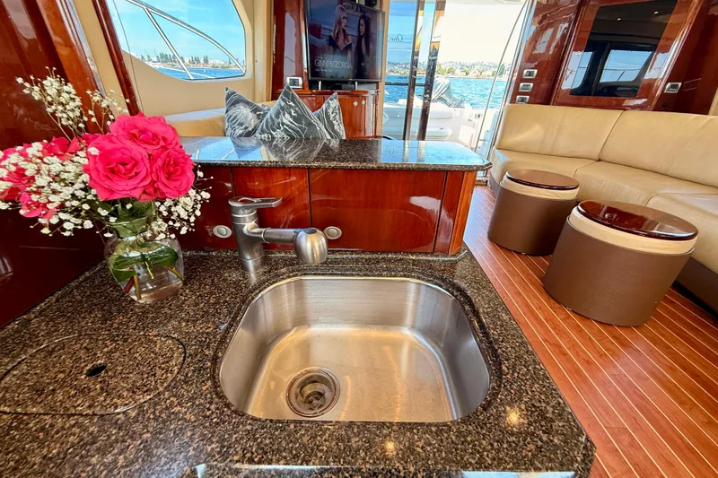 Slide: The Image of Luxurious 2007 Sea Ray 52 Sedan Bridge interior with elegant kitchen and seating area. - 74