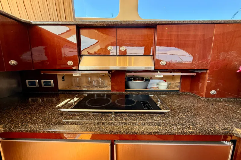 Slide: The Image of Luxurious kitchen interior of 2007 Sea Ray 52 Sedan Bridge yacht with modern appliances. - 75