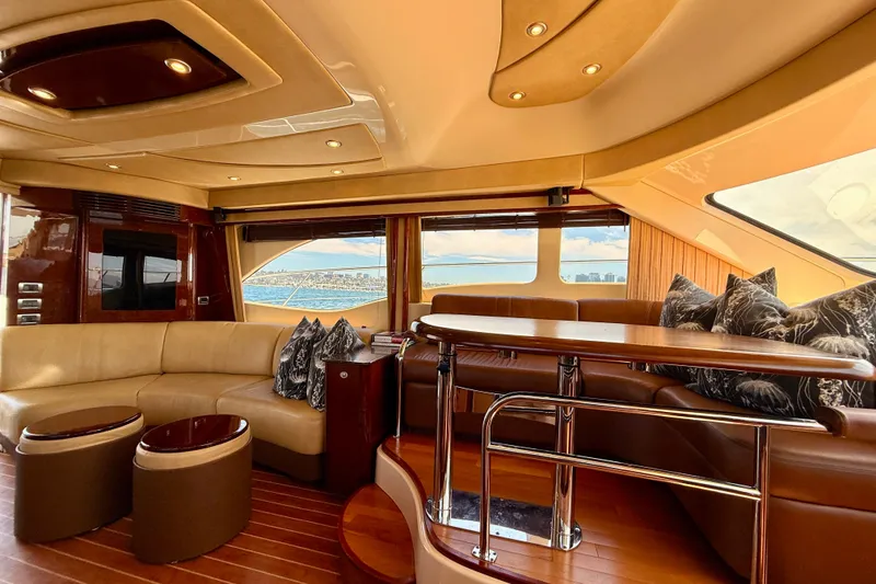 Slide: The Image of Luxurious interior of a 2007 Sea Ray 52 Sedan Bridge yacht with elegant seating and panoramic windows. - 77