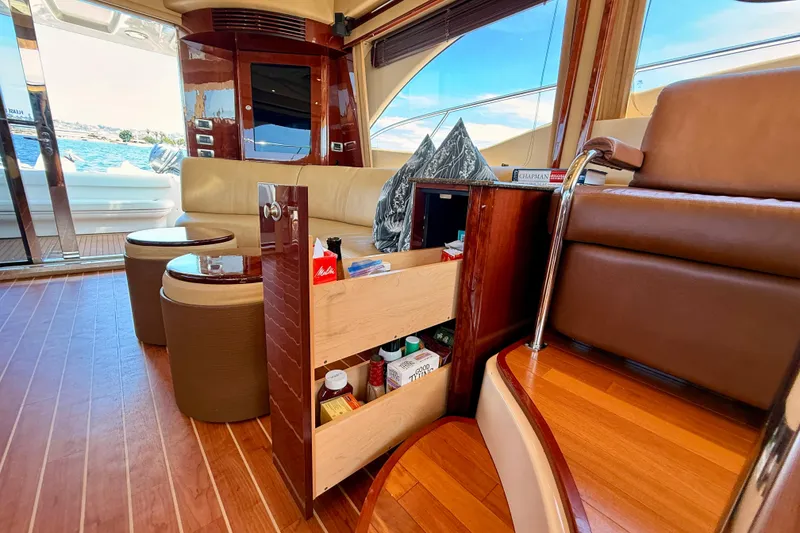 Slide: The Image of Luxurious interior of 2007 Sea Ray 52 Sedan Bridge yacht with elegant wood finishes. - 78