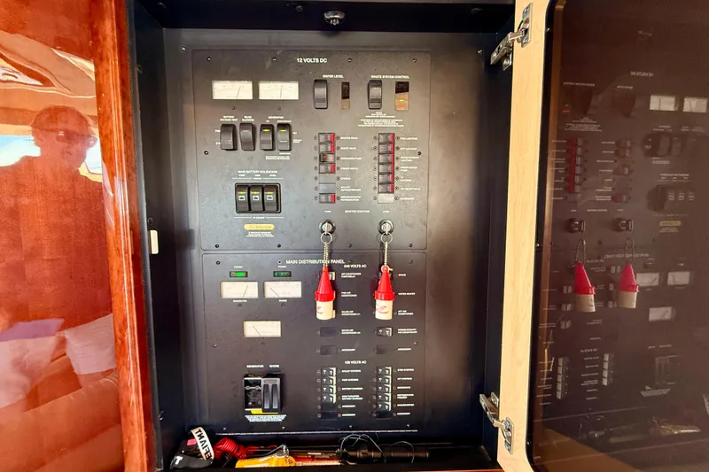 Slide: The Image of Electrical control panel inside a 2007 Sea Ray 52 Sedan Bridge yacht. - 79
