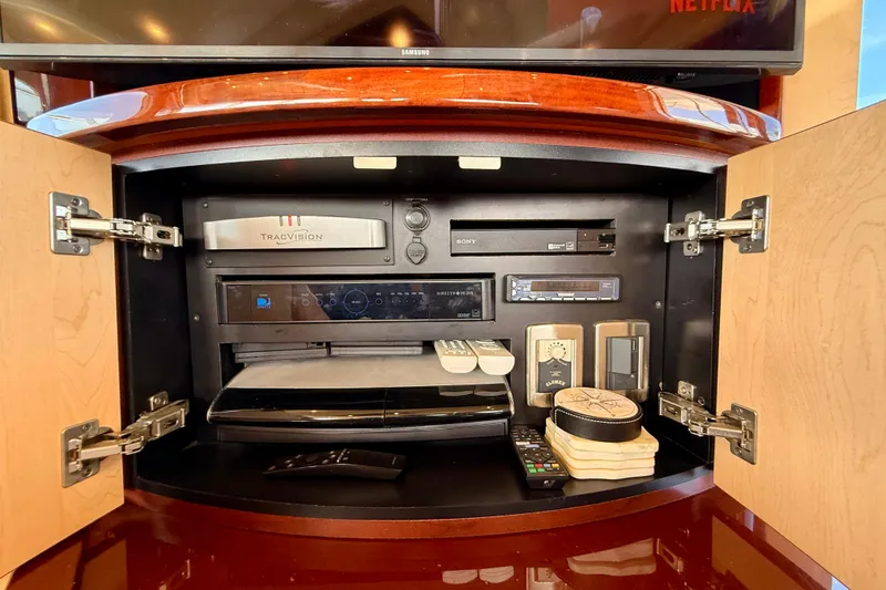 Slide: The Image of Entertainment system cabinet on a 2007 Sea Ray 52 Sedan Bridge yacht. - 80