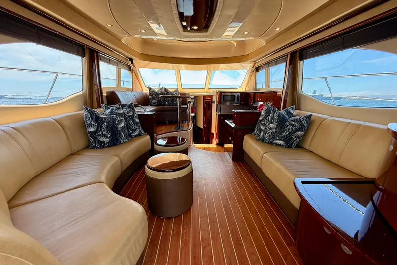 Slide: The Image of Luxurious interior of 2007 Sea Ray 52 Sedan Bridge yacht with elegant seating and panoramic windows. - 81