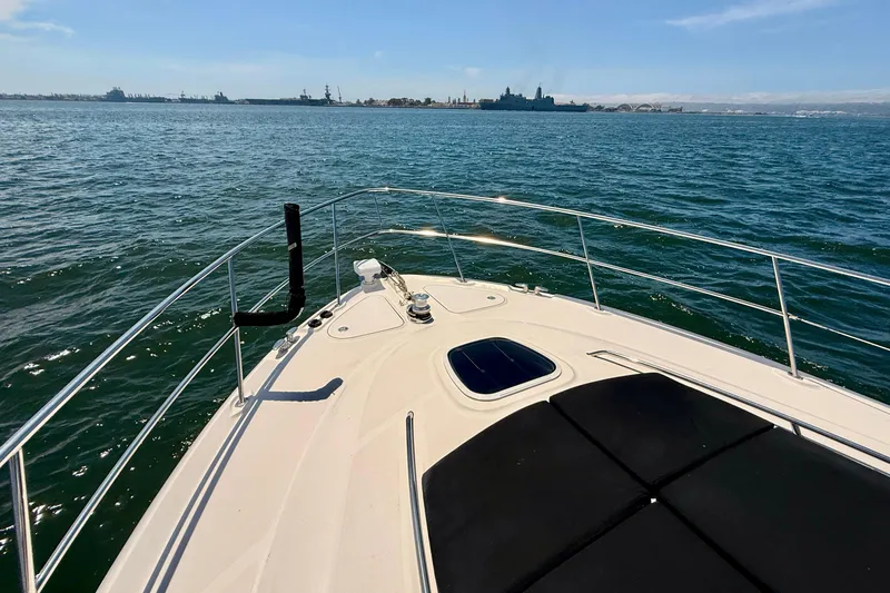 Slide: The Image of Bow view of 2007 Sea Ray 52 Sedan Bridge yacht on open water. - 82