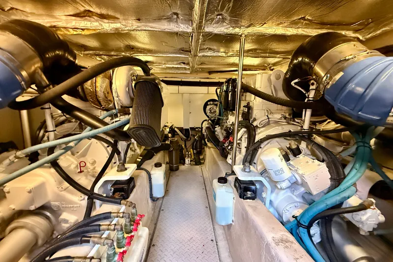 Slide: The Image of Engine room of a 2007 Sea Ray 52 Sedan Bridge yacht, showcasing dual engines and components. - 86