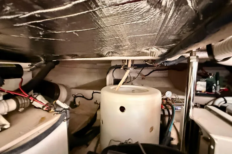 Slide: The Image of Engine room of 2007 Sea Ray 52 Sedan Bridge with visible wiring and components. - 89