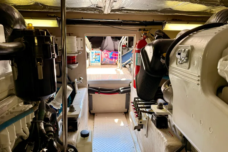 Slide: The Image of Engine room of a 2007 Sea Ray 52 Sedan Bridge yacht, showcasing machinery and equipment. - 90