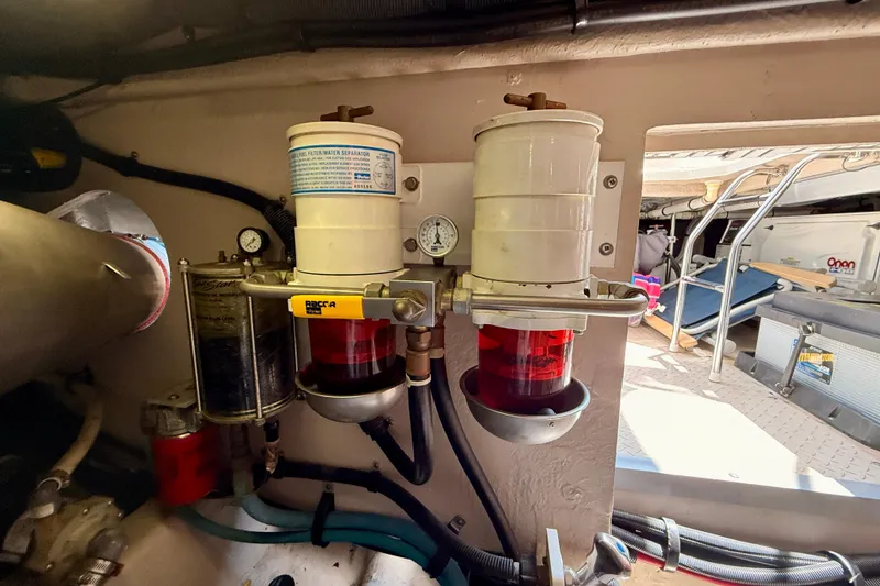 Slide: The Image of Engine room of 2007 Sea Ray 52 Sedan Bridge with fuel filter system. - 91
