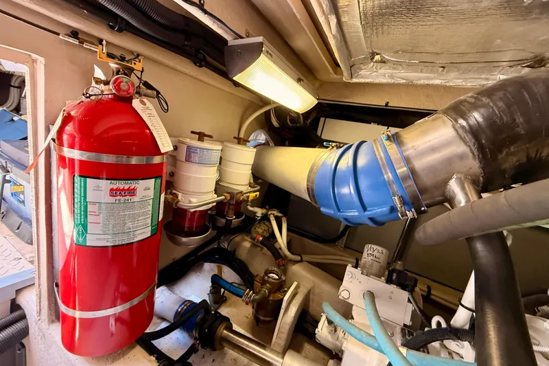 Slide: The Image of Engine room of 2007 Sea Ray 52 Sedan Bridge with fire extinguisher and ventilation system. - 92