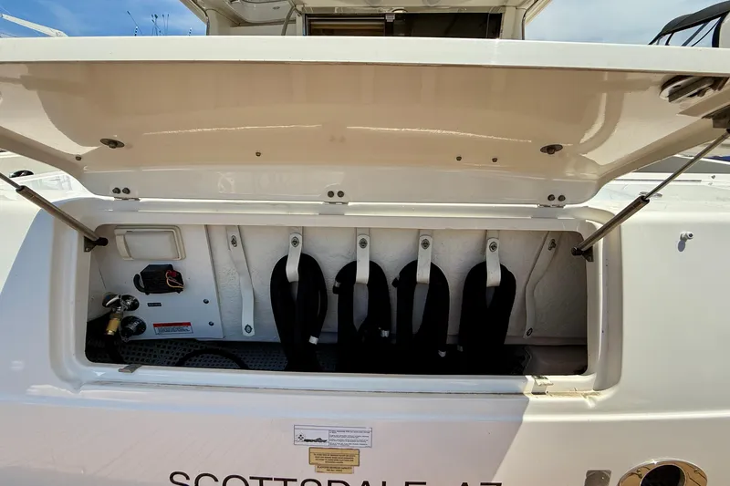 Slide: The Image of Open storage compartment on a 2007 Sea Ray 52 Sedan Bridge yacht. - 94