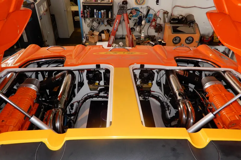 Slide: The Image of 2008 Nor-Tech 3600 Supercat engine bay with vibrant orange detailing in a workshop setting. - 30