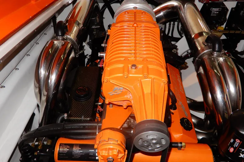 Slide: The Image of 2008 Nor-Tech 3600 Supercat engine with vibrant orange components and polished exhaust pipes. - 32