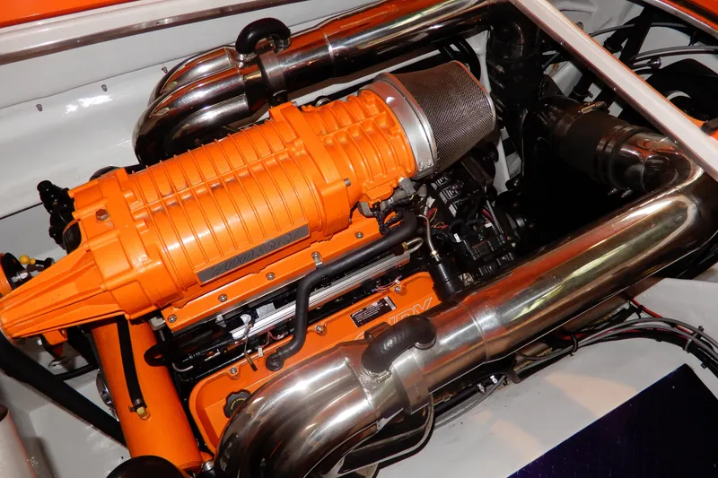 Slide: The Image of 2008 Nor-Tech 3600 Supercat engine with vibrant orange components and polished metal pipes. - 33