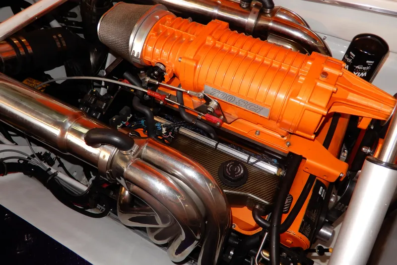 Slide: The Image of 2008 Nor-Tech 3600 Supercat engine with vibrant orange components and metallic exhaust system. - 34