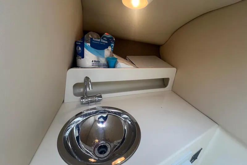 Slide: The Image of 2017 Chris-Craft Launch 28 interior with sink and storage area. - 12