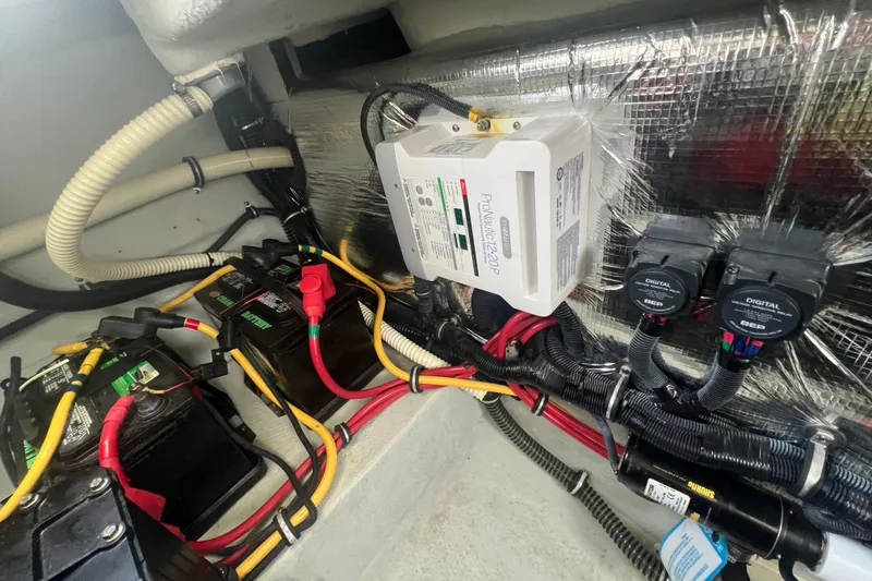 Slide: The Image of Engine compartment of 2017 Chris-Craft Launch 28 with batteries and wiring system. - 15