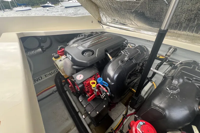 Slide: The Image of 2017 Chris-Craft Launch 28 engine compartment with visible components and wiring. - 18