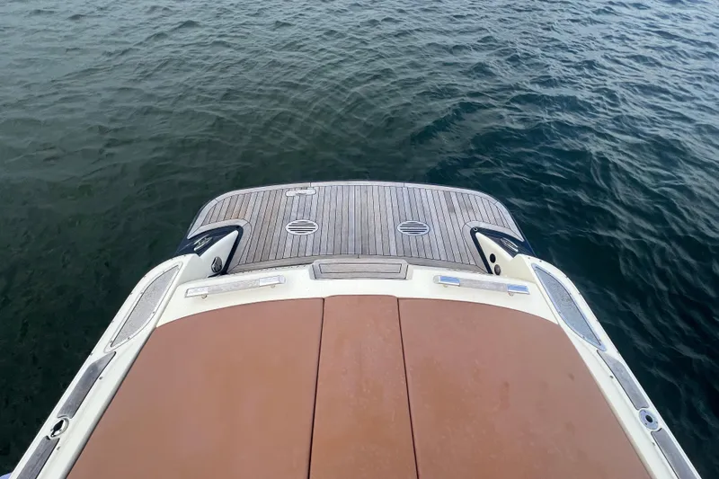 Slide: The Image of 2017 Chris-Craft Launch 28 boat stern view on calm water. - 20