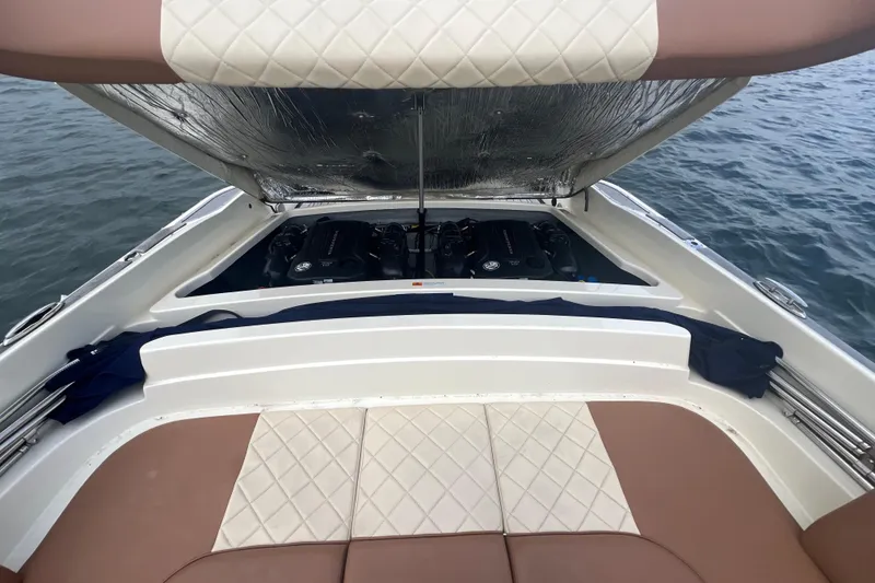 Slide: The Image of 2017 Chris-Craft Launch 28 boat engine compartment with open hatch, on water. - 3