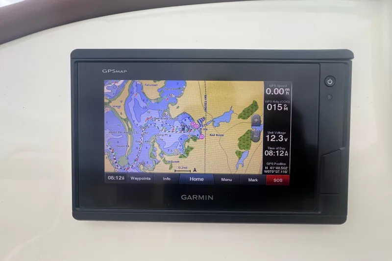 Slide: The Image of Garmin GPS display on 2017 Chris-Craft Launch 28 boat, showing nautical map and navigation data. - 8