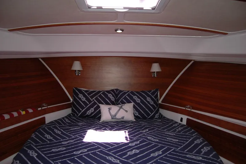 Slide: The Image of Luxurious cabin interior of 2014 Back Cove 37 yacht with nautical-themed bedding. - 100