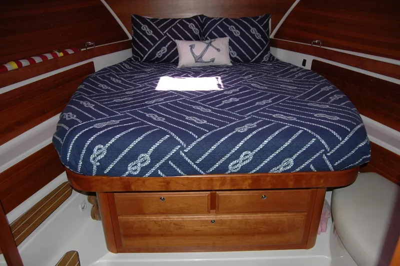 Slide: The Image of Cozy cabin interior of 2014 Back Cove 37 with nautical-themed bedding. - 101