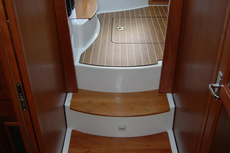 Slide: The Image of Interior steps of a 2014 Back Cove 37 boat with wooden finish. - 118