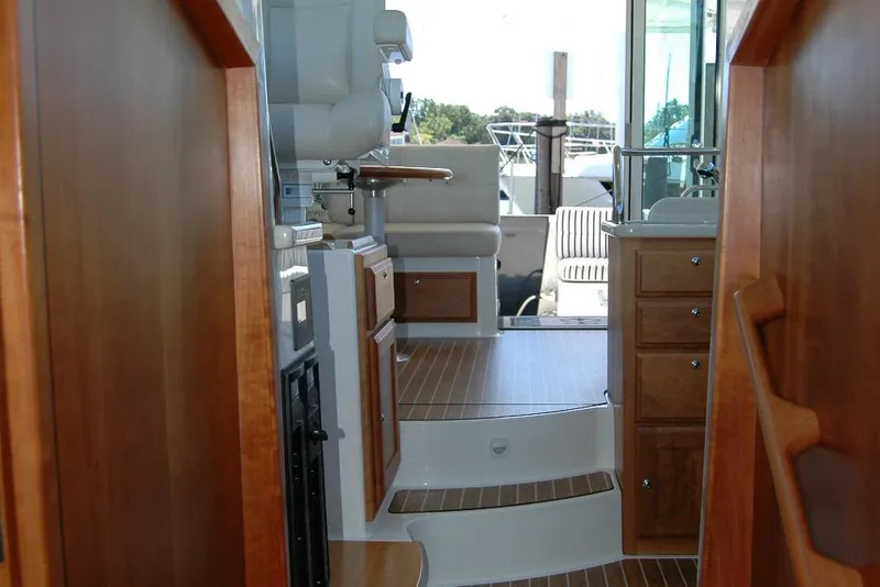 Slide: The Image of Interior view of 2014 Back Cove 37 yacht with wooden cabinetry and seating area. - 119