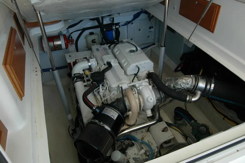 Slide: The Image of Engine room of 2014 Back Cove 37 boat, showcasing detailed mechanical components. - 120