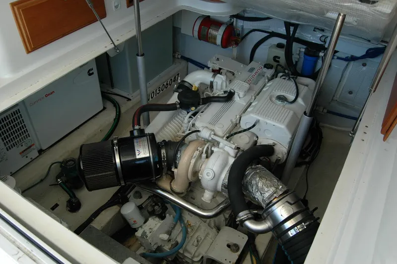Slide: The Image of Engine room of a 2014 Back Cove 37 boat, featuring a Cummins engine. - 121
