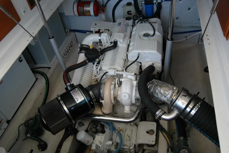 Slide: The Image of Engine compartment of a 2014 Back Cove 37 boat, featuring detailed mechanical components. - 123