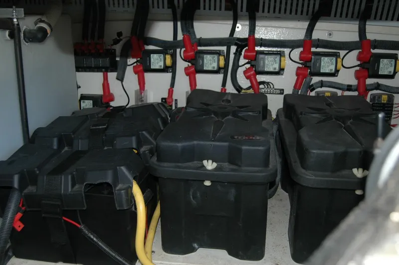 Slide: The Image of Battery compartment of a 2014 Back Cove 37 boat with wiring and connections. - 136