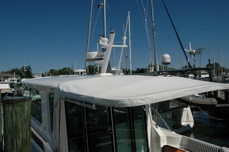 Slide: The Image of 2014 Back Cove 37 yacht docked at marina under clear blue sky. - 17