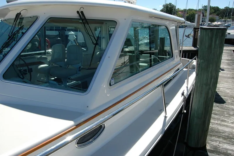 Slide: The Image of 2014 Back Cove 37 yacht docked, showcasing sleek design and spacious interior. - 22