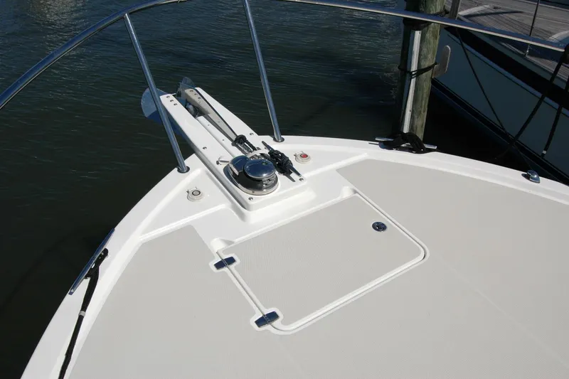 Slide: The Image of 2014 Back Cove 37 boat deck with anchor and railing in marina. - 35