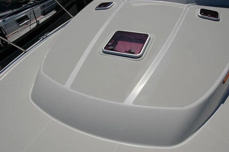 Slide: The Image of 2014 Back Cove 37 yacht deck with hatch and sleek design. - 45