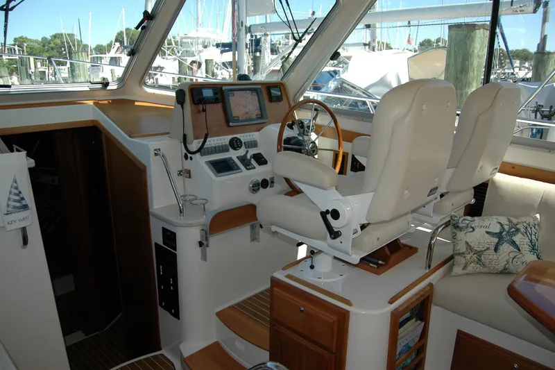 Slide: The Image of Interior of 2014 Back Cove 37 yacht with helm station and plush seating. - 62