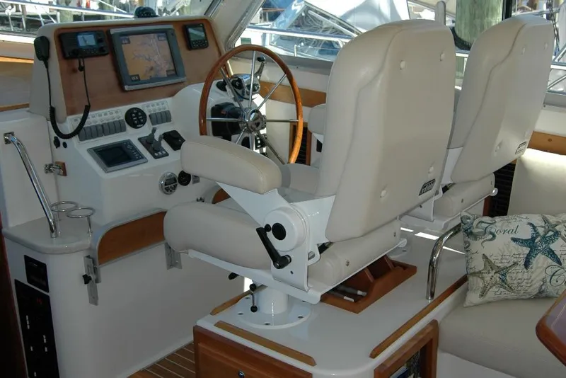 Slide: The Image of Helm station of 2014 Back Cove 37 with dual seats and navigation equipment. - 63