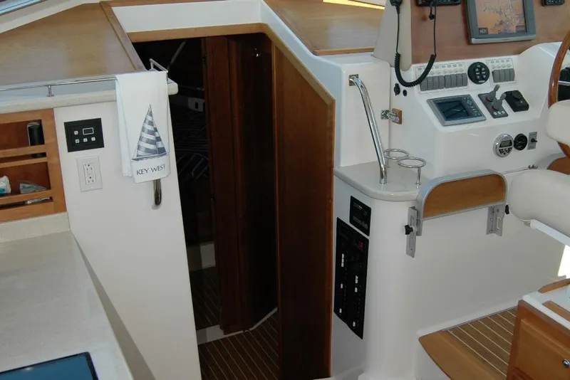 Slide: The Image of Interior of 2014 Back Cove 37 yacht with navigation controls and wooden accents. - 64