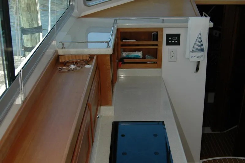 Slide: The Image of Interior of 2014 Back Cove 37 yacht, featuring a sleek countertop and storage area. - 65