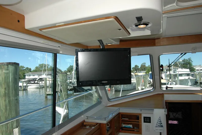 Slide: The Image of Interior of 2014 Back Cove 37 yacht with TV and marina view. - 69
