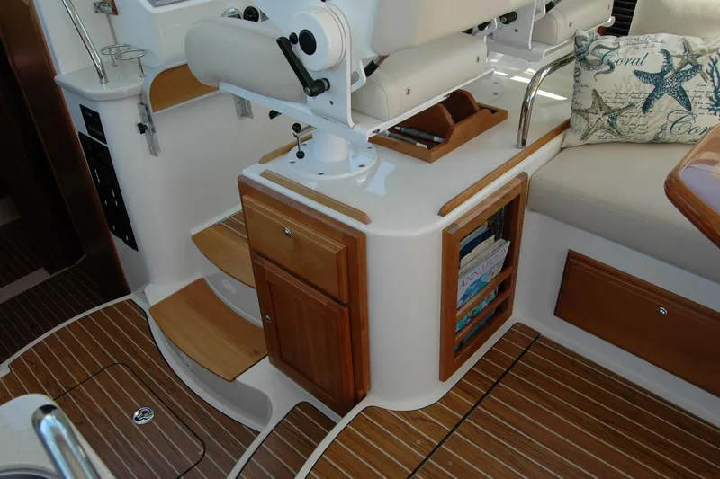 Slide: The Image of 2014 Back Cove 37 yacht interior with wooden cabinetry and seating area. - 71
