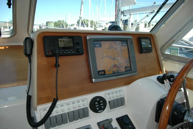 Slide: The Image of 2014 Back Cove 37 helm with navigation equipment and controls. - 73