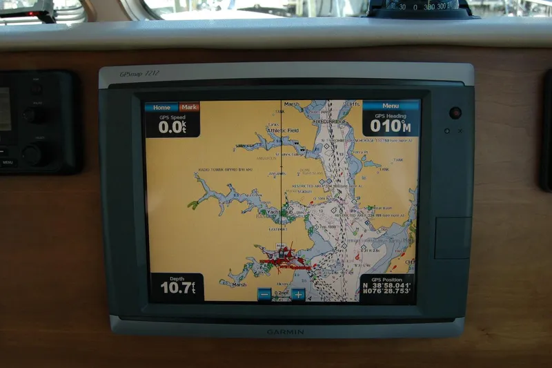 Slide: The Image of Garmin GPS display on 2014 Back Cove 37 boat, showing nautical map and navigation data. - 76