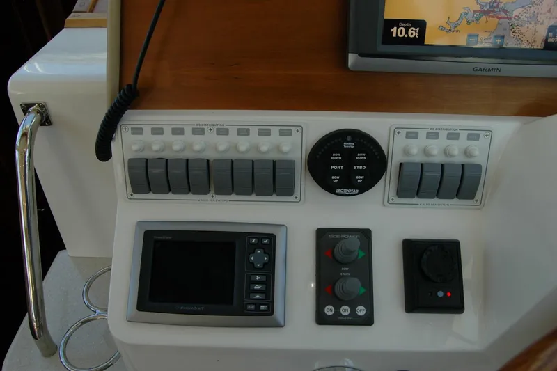 Slide: The Image of Control panel of a 2014 Back Cove 37 boat with navigation and distribution systems. - 79