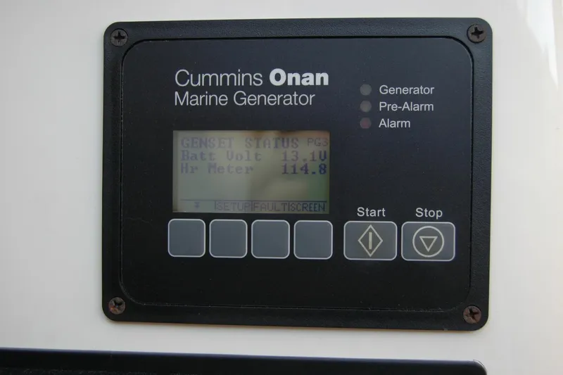 Slide: The Image of Cummins Onan marine generator display on 2014 Back Cove 37 boat, showing battery voltage and hour meter. - 81