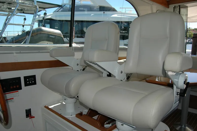 Slide: The Image of Interior of 2014 Back Cove 37 yacht with two white captain's chairs. - 85